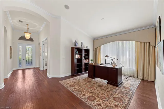 a kitchen with stainless steel appliances granite countertop a sink refrigerator and cabinets