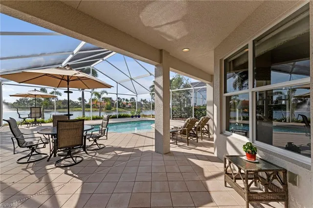a swimming pool with patio outdoor seating and yard