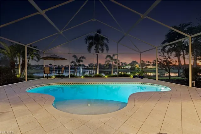 a view of a swimming pool with a patio