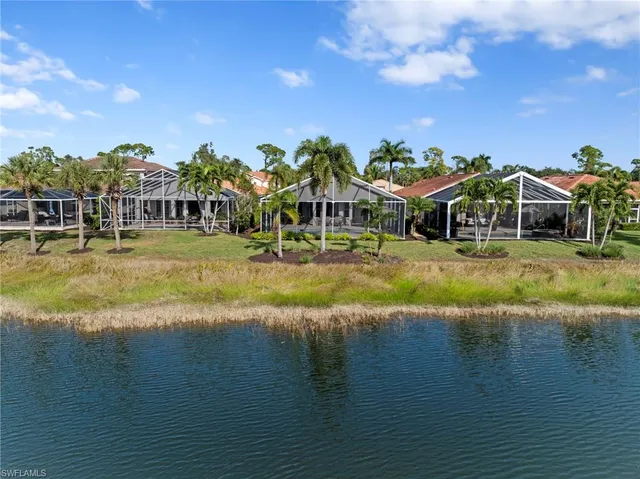 a living room with furniture potted plant and a flat screen tv