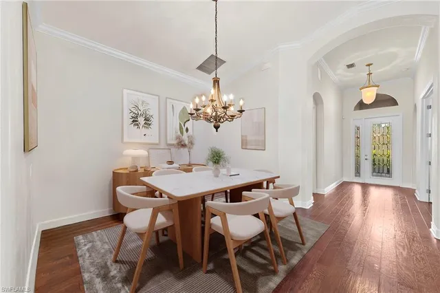a living room with lots of furniture and a large window