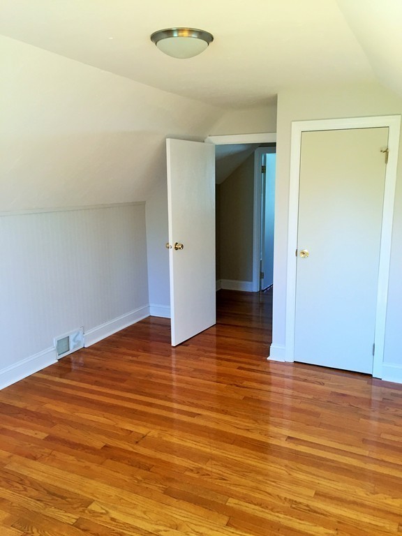 33 2nd Island Road Webster, MA 01570 - Photo 18 of 27 a view of an empty room with wooden floor