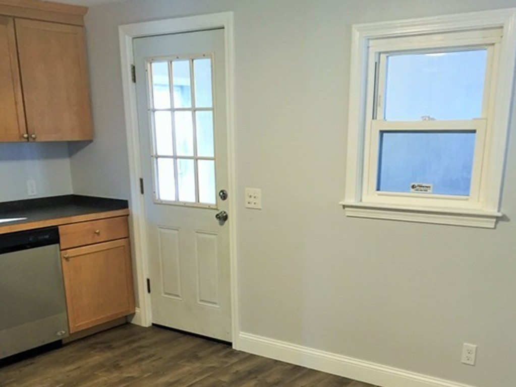 33 2nd Island Road Webster, MA 01570 - Photo 4 of 27 a view of a kitchen with wooden floor and cabinet