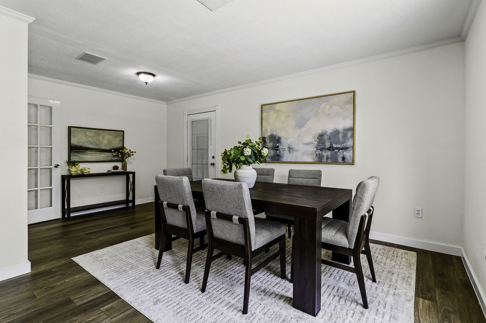 51 Rustling Oaks Coldspring, TX 77331 - Photo 6 of 43 Just as you walk in to your right, Dining area. Door along the back wall leads to a large screen in deck with views of the side lot (lot 16)