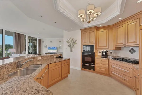 a spacious bathroom with a double vanity sink a large mirror and a bathtub