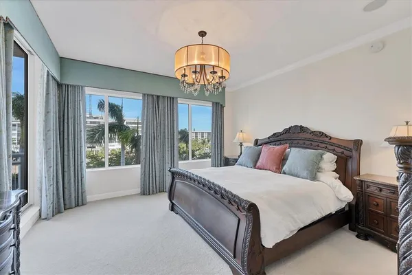 a bedroom with a bed and a view of bathroom