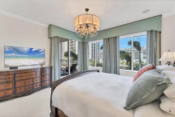 a bedroom with a bed and a mirror