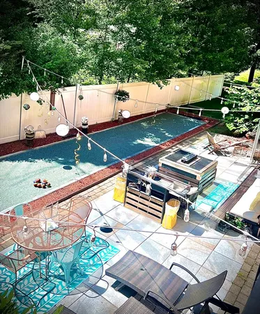 a view of a swimming pool with a patio
