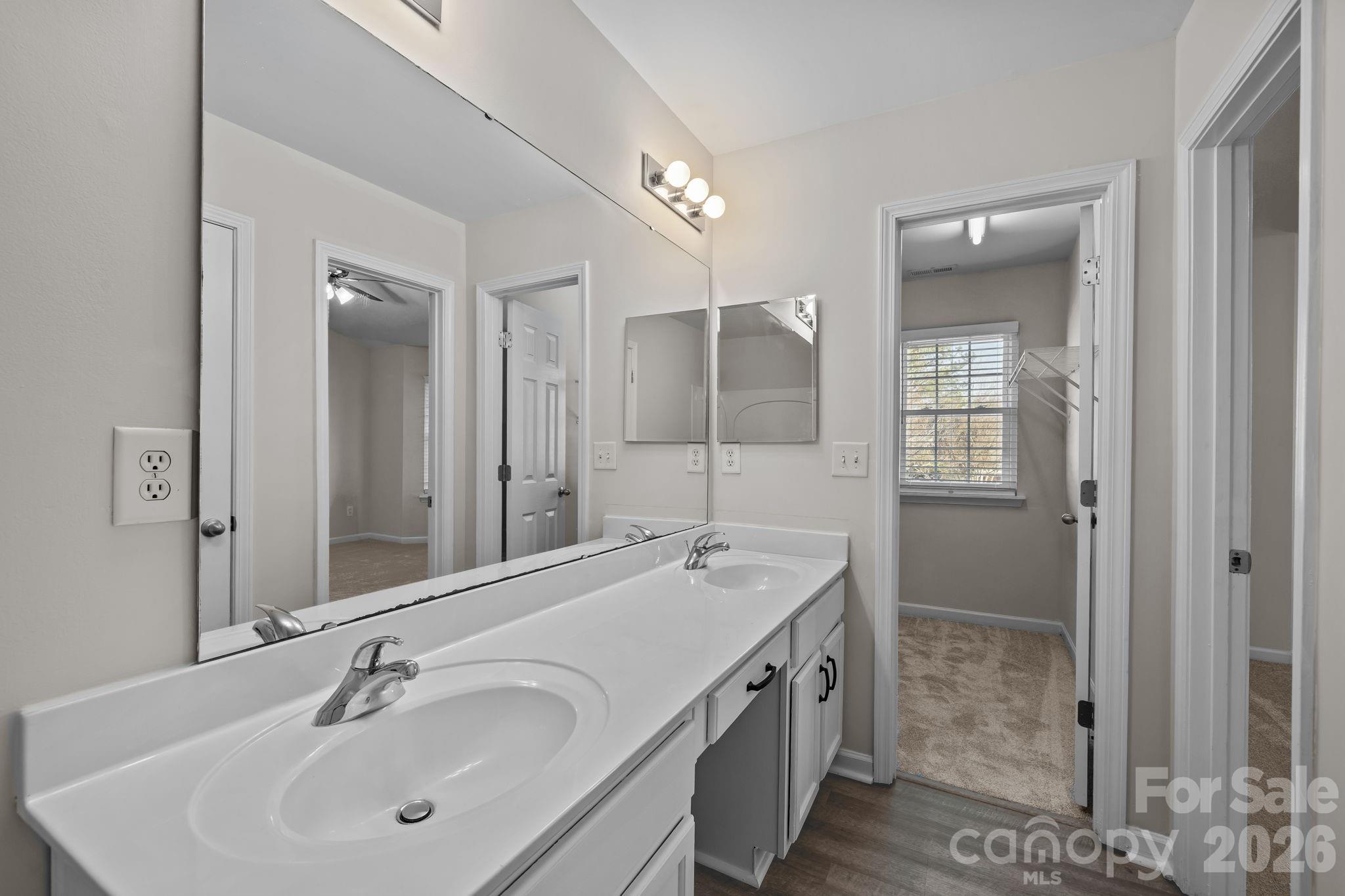 209 Primrose Walk Fort Mill, SC 29715 - Photo 23 of 39 a bathroom with a sink a shower and a mirror