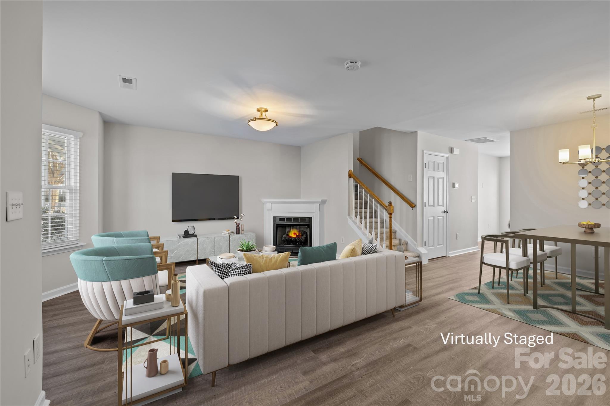 209 Primrose Walk Fort Mill, SC 29715 - Photo 7 of 39 a living room with furniture and a flat screen tv