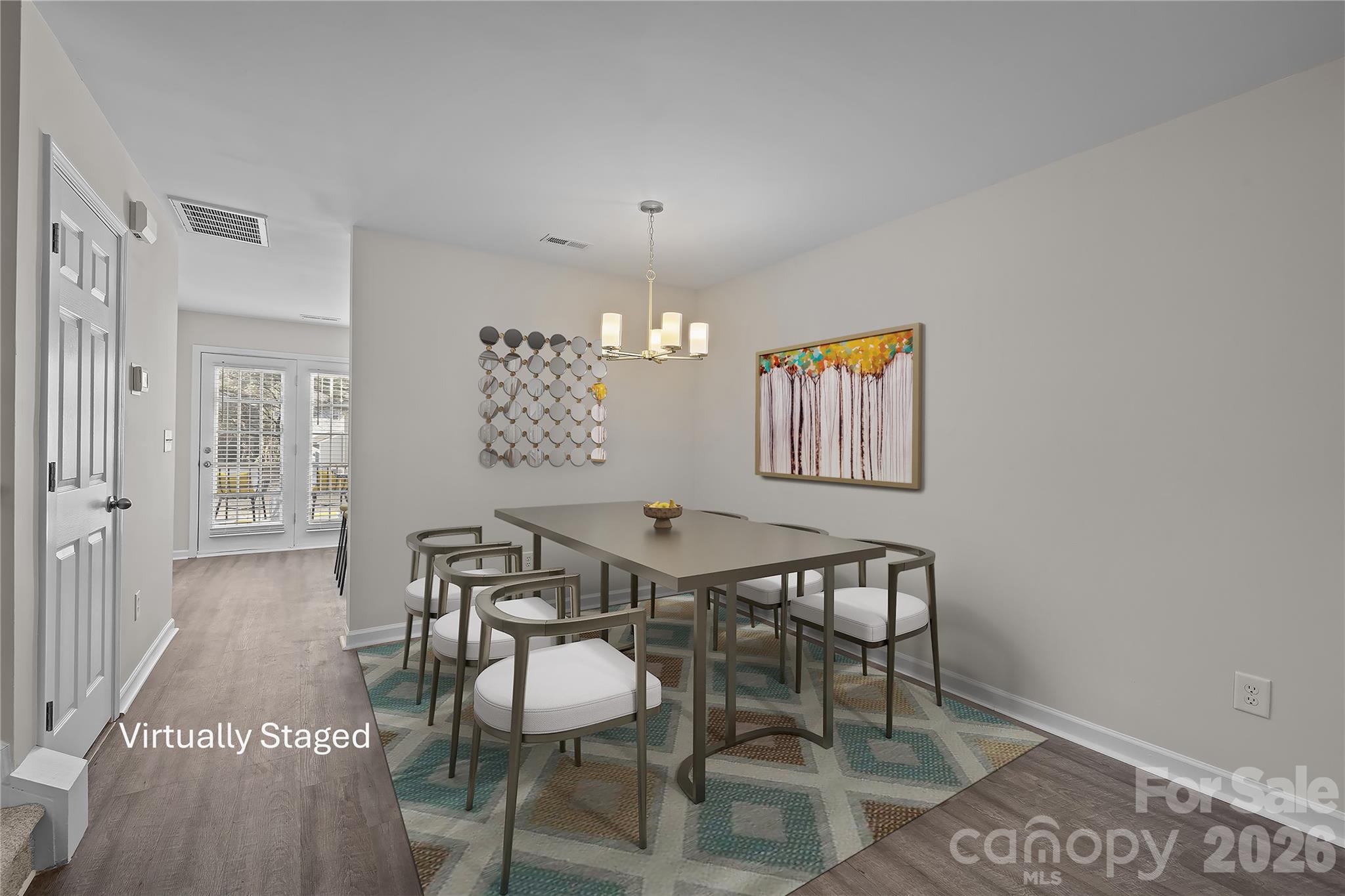 209 Primrose Walk Fort Mill, SC 29715 - Photo 8 of 39 a view of a dining room with furniture and wooden floor