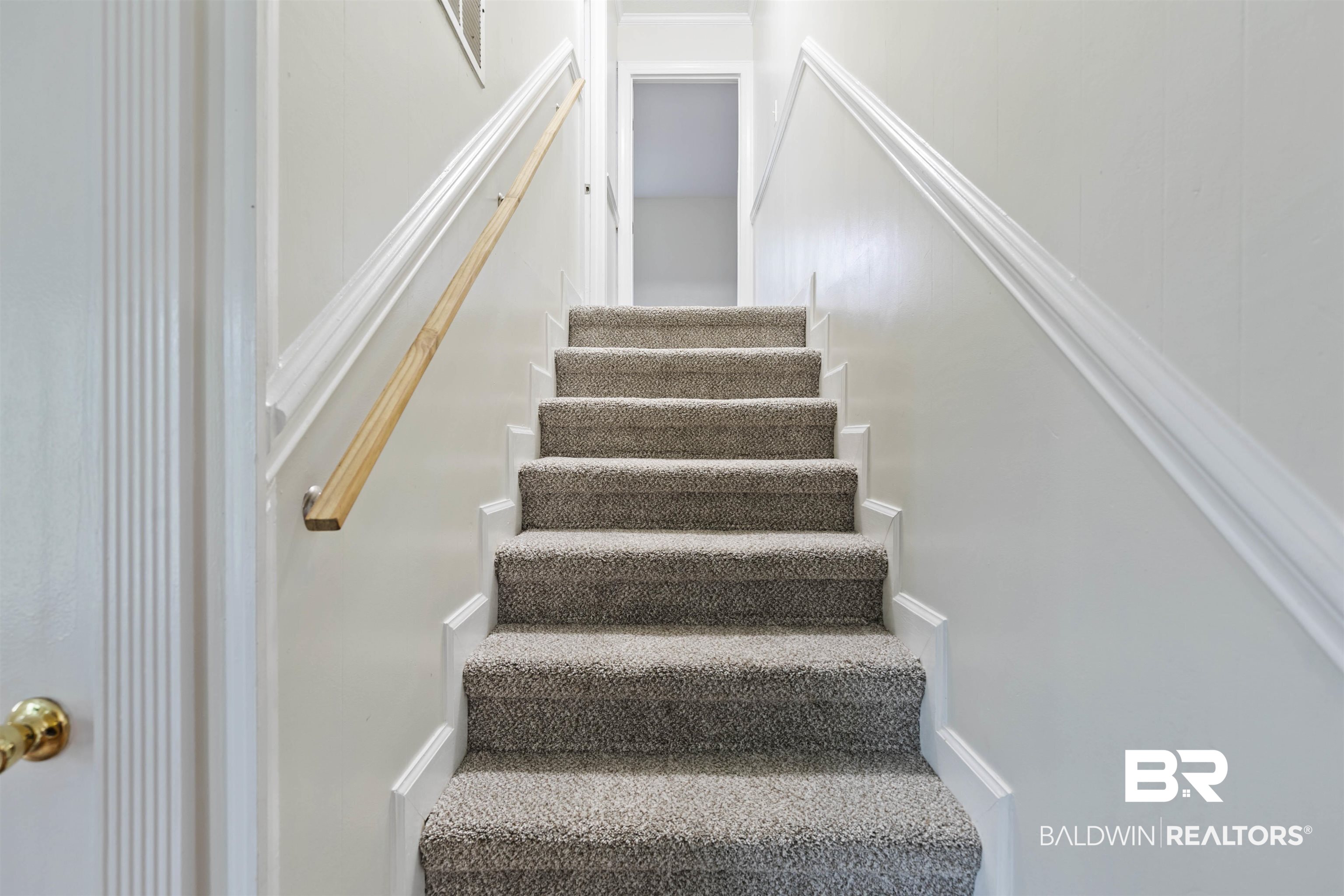 10420 Johnson Road South Mobile, AL 36695 - Photo 37 of 75 Carpeted staircase with light gray carpeting, white risers, and white baseboards