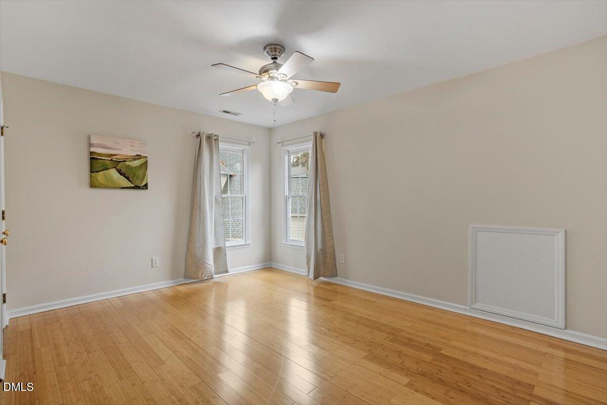 2804 Shofield Court Raleigh, NC 27615 - Photo 22 of 37 a view of livingroom with hardwood floor and ceiling fan