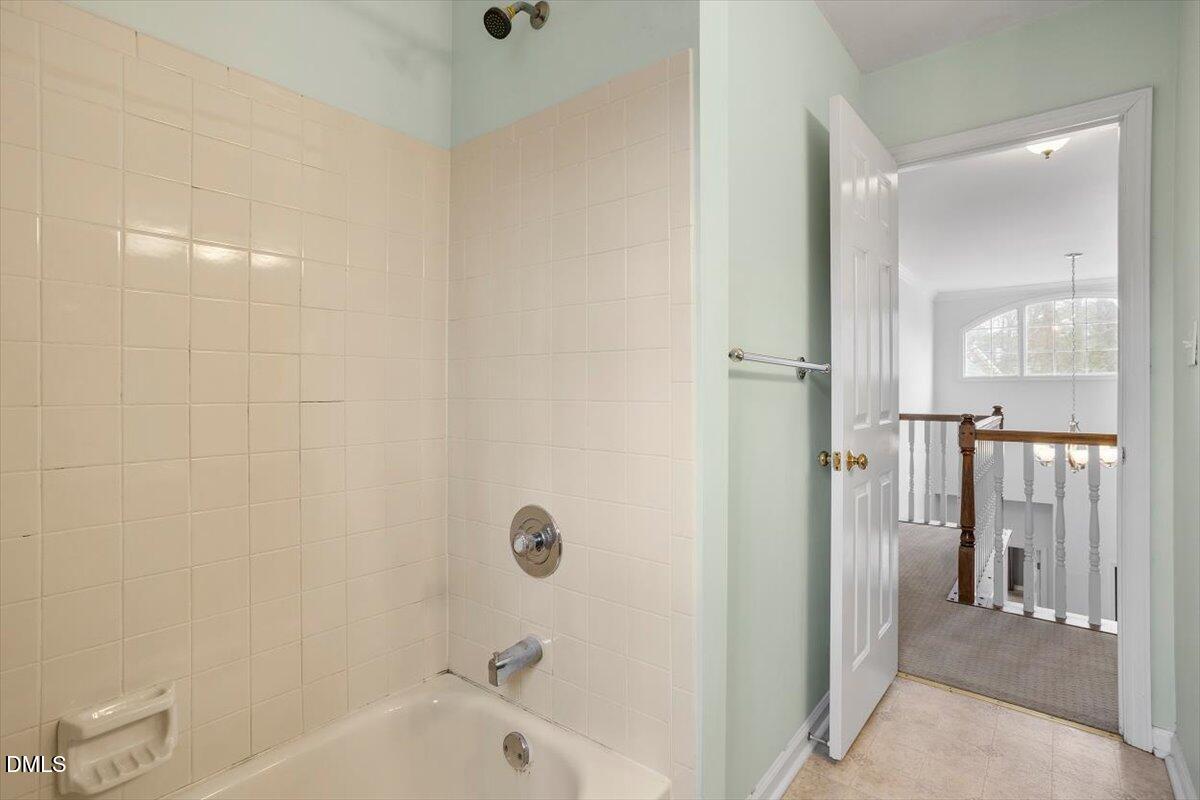 2804 Shofield Court Raleigh, NC 27615 - Photo 25 of 37 a bathroom with a bathtub
