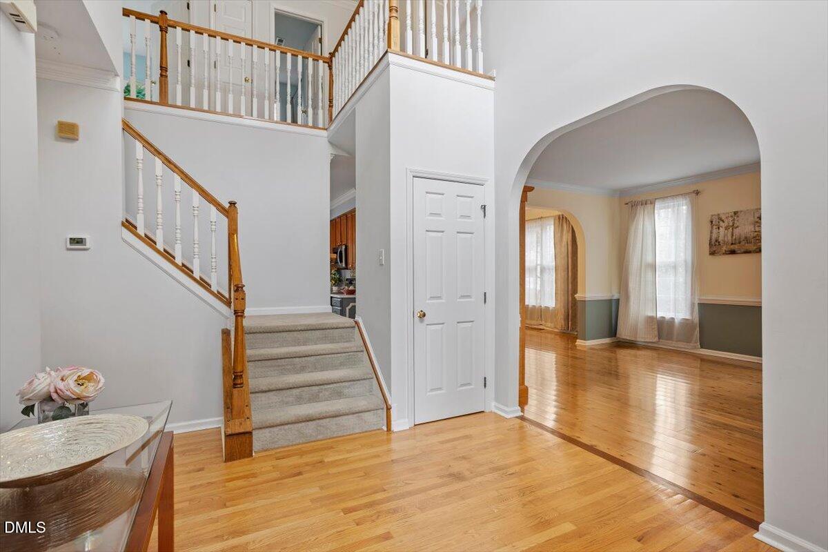 2804 Shofield Court Raleigh, NC 27615 - Photo 2 of 37 a view of entryway and hall with wooden floor