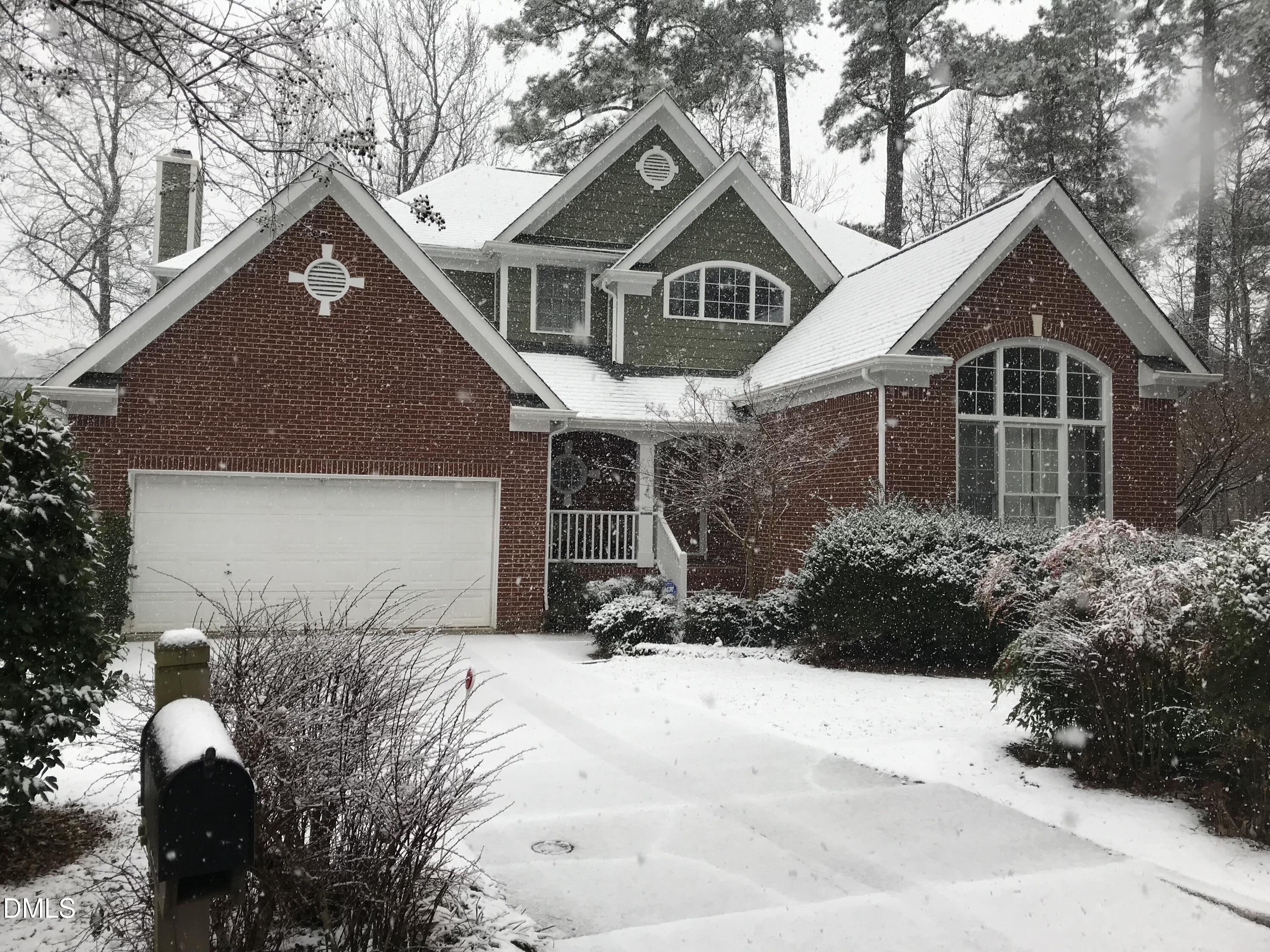 2804 Shofield Court Raleigh, NC 27615 - Photo 35 of 37 a front view of a house with a yard and garage