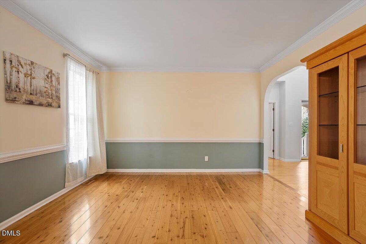2804 Shofield Court Raleigh, NC 27615 - Photo 3 of 37 an empty room with wooden floor and windows