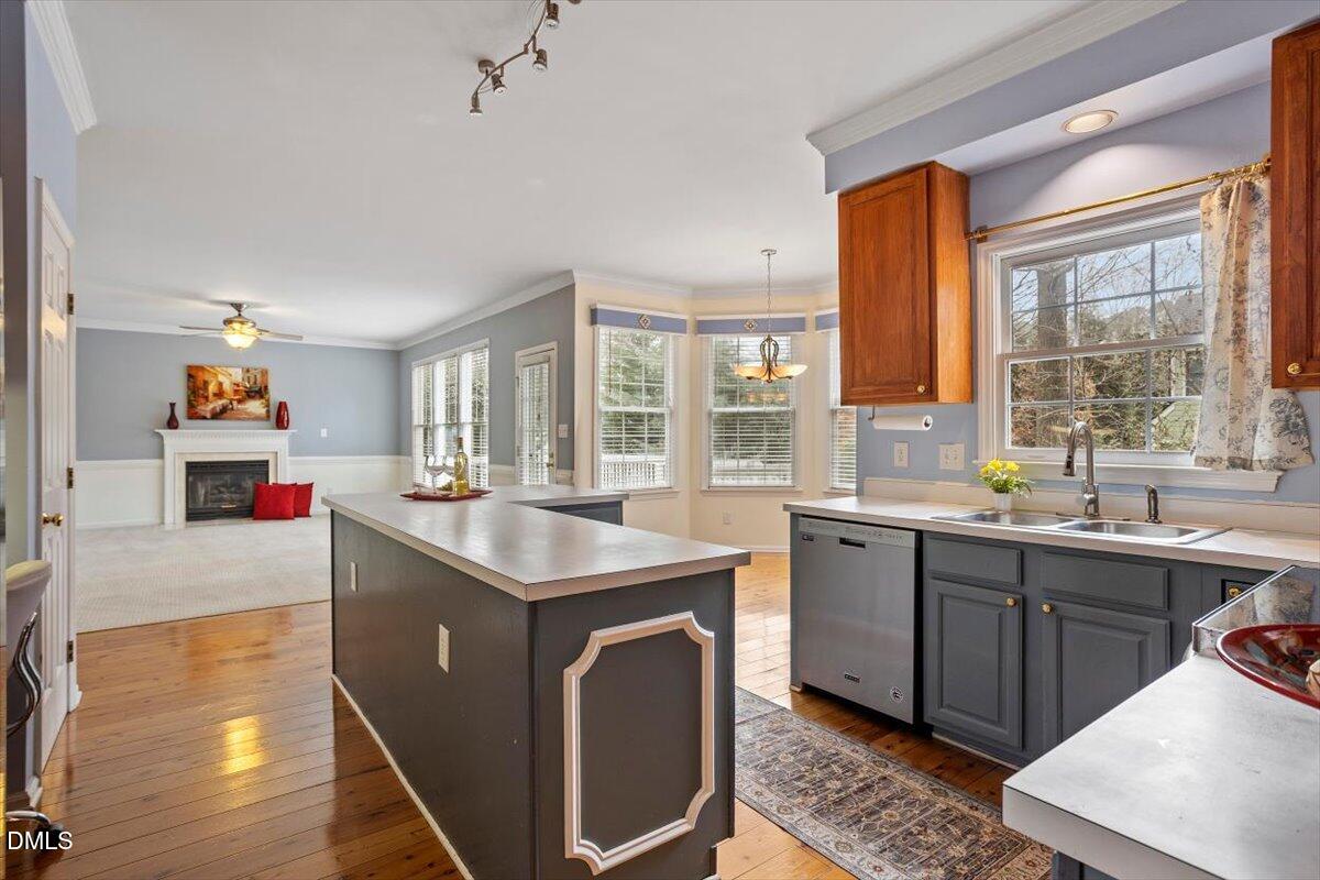 2804 Shofield Court Raleigh, NC 27615 - Photo 9 of 37 a kitchen with a sink stove and cabinets