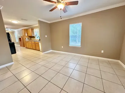 a utility room with cabinets washer and dryer