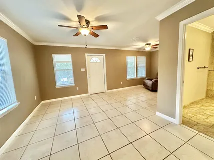 a balcony with table and chairs