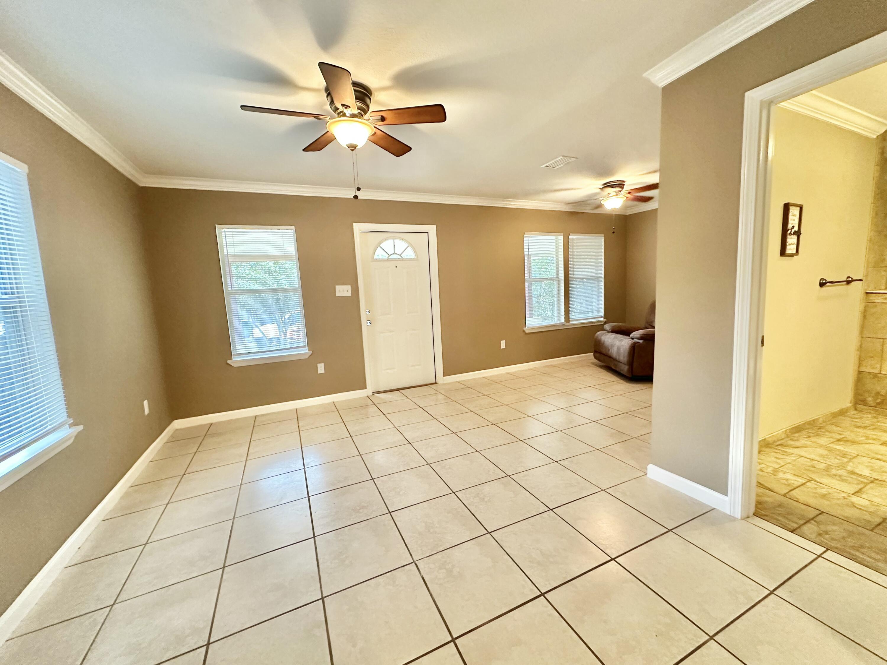 120 North Davis Lane DeFuniak Springs, FL 32433 - Photo 16 of 58 a view of an empty room and window