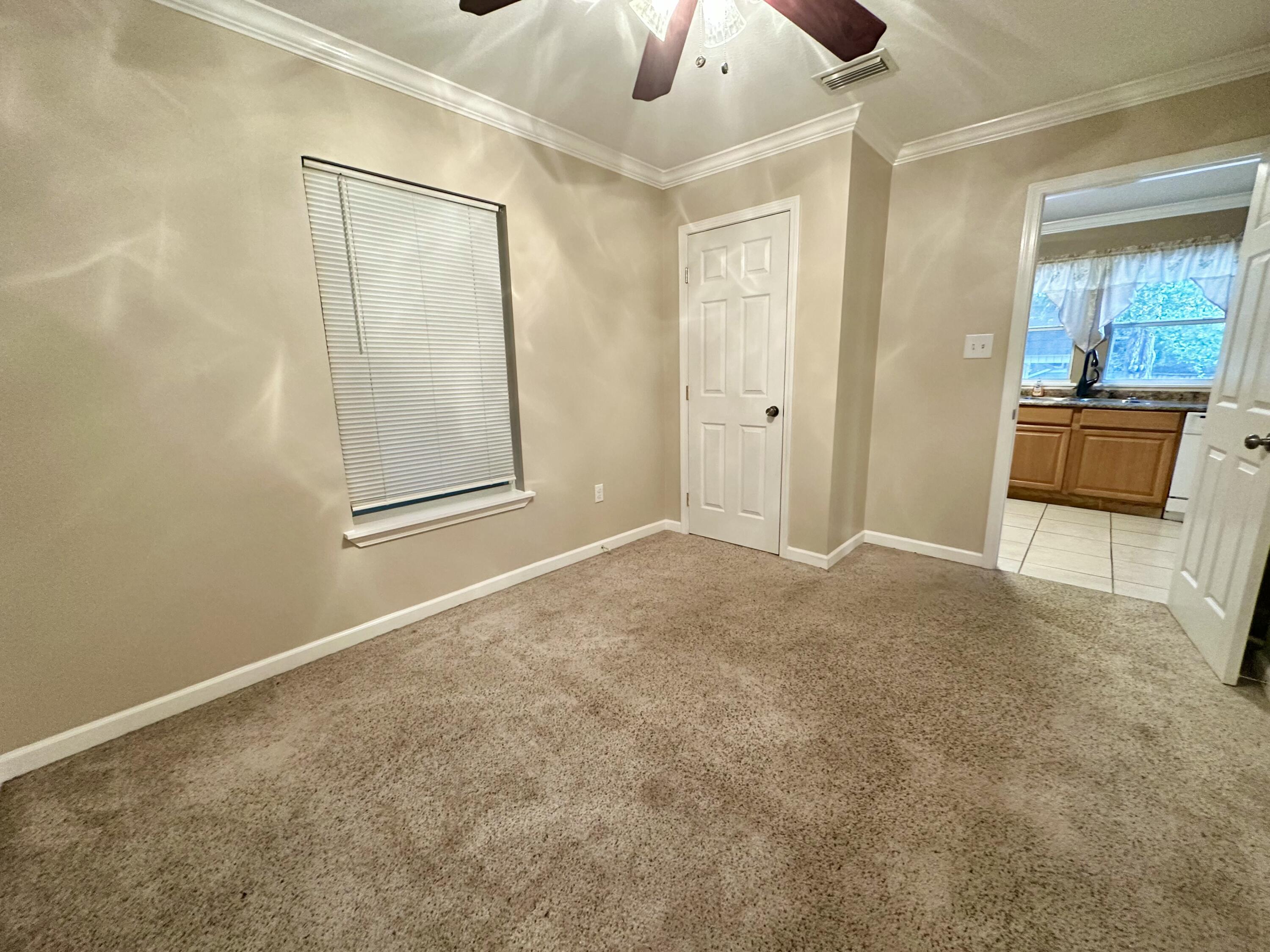 120 North Davis Lane DeFuniak Springs, FL 32433 - Photo 23 of 58 an empty room with a bathroom and mirror