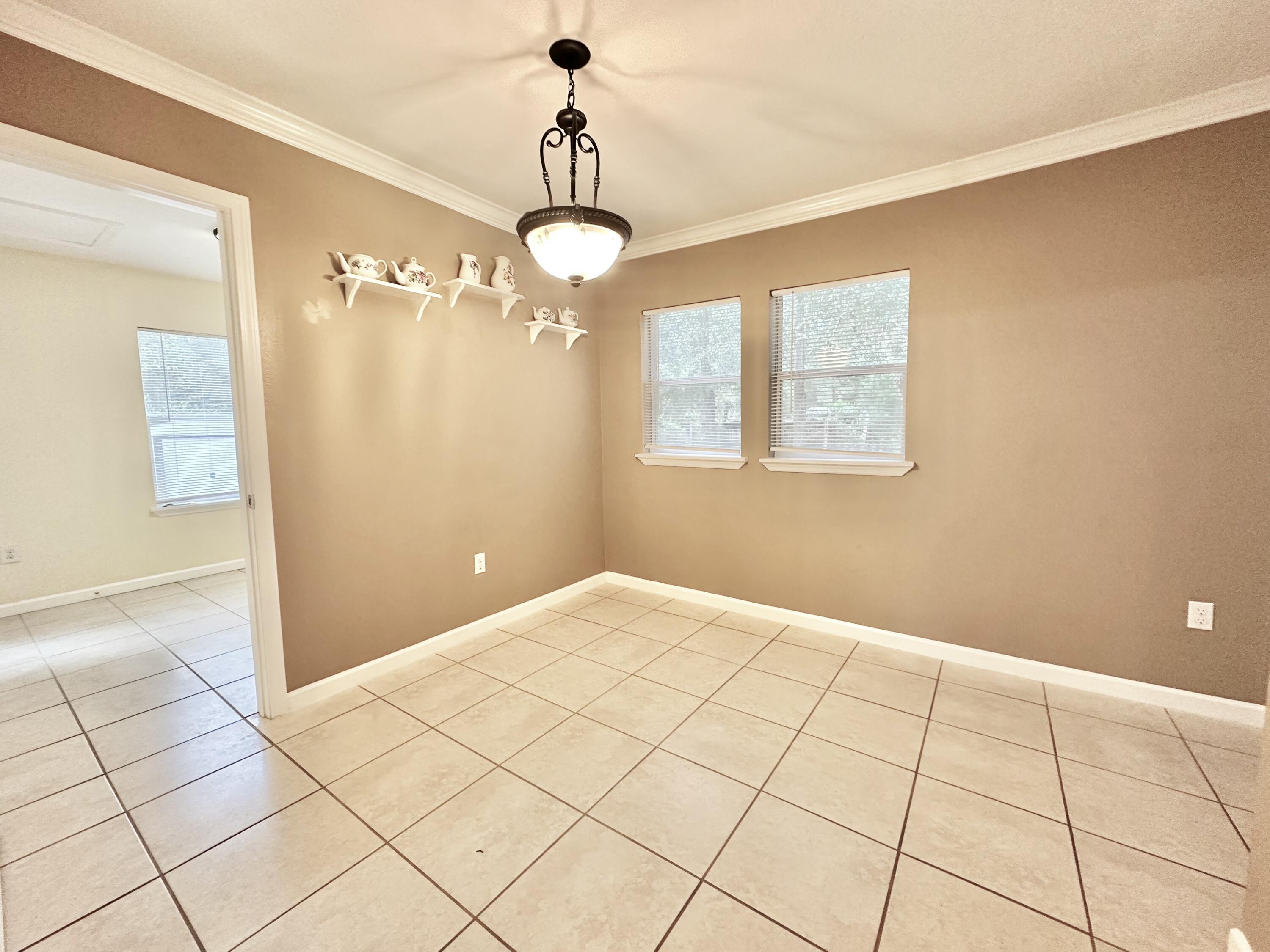 120 North Davis Lane DeFuniak Springs, FL 32433 - Photo 34 of 58 a view of an empty room and window