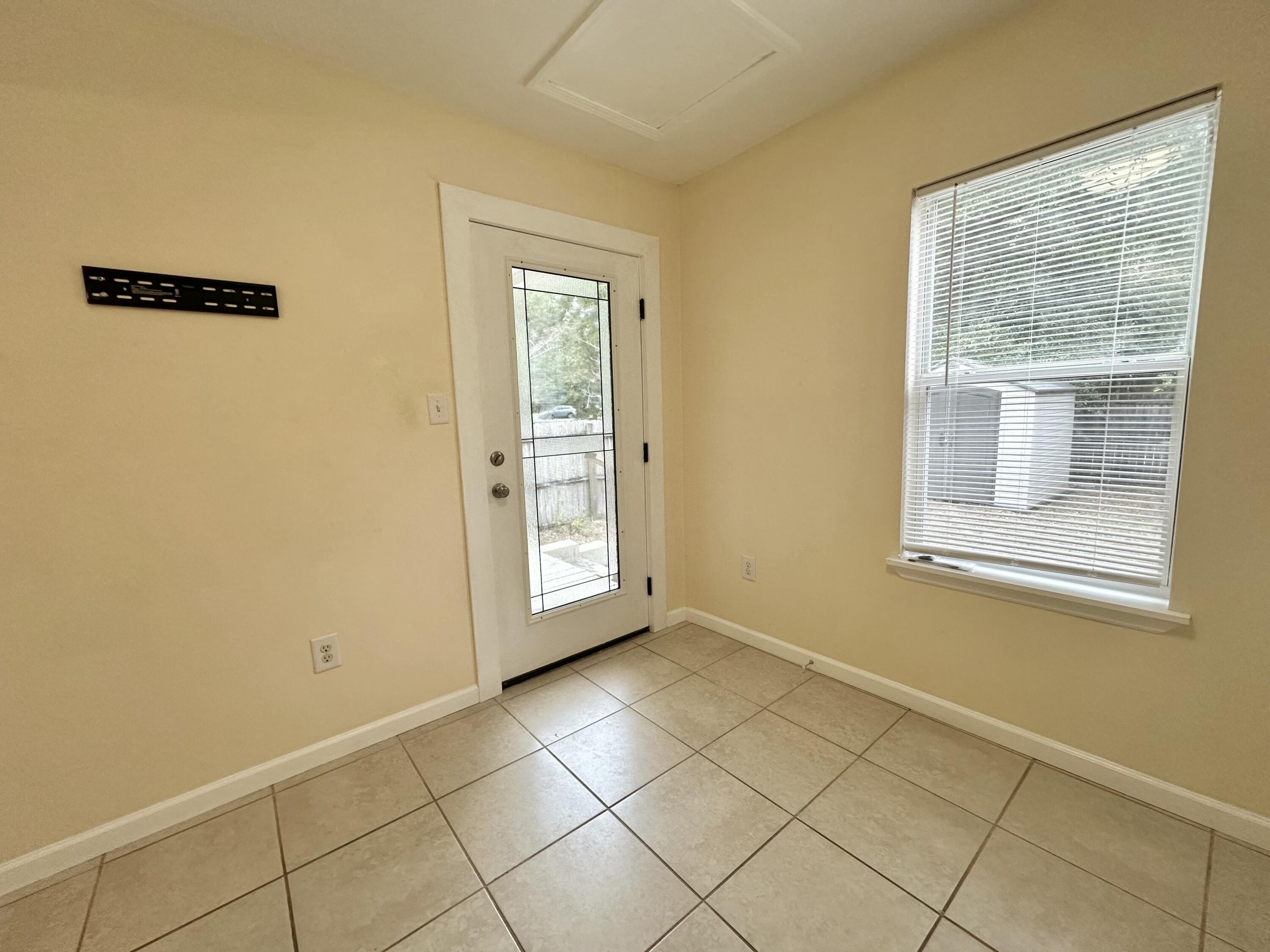 120 North Davis Lane DeFuniak Springs, FL 32433 - Photo 36 of 58 a view of an empty room with a window