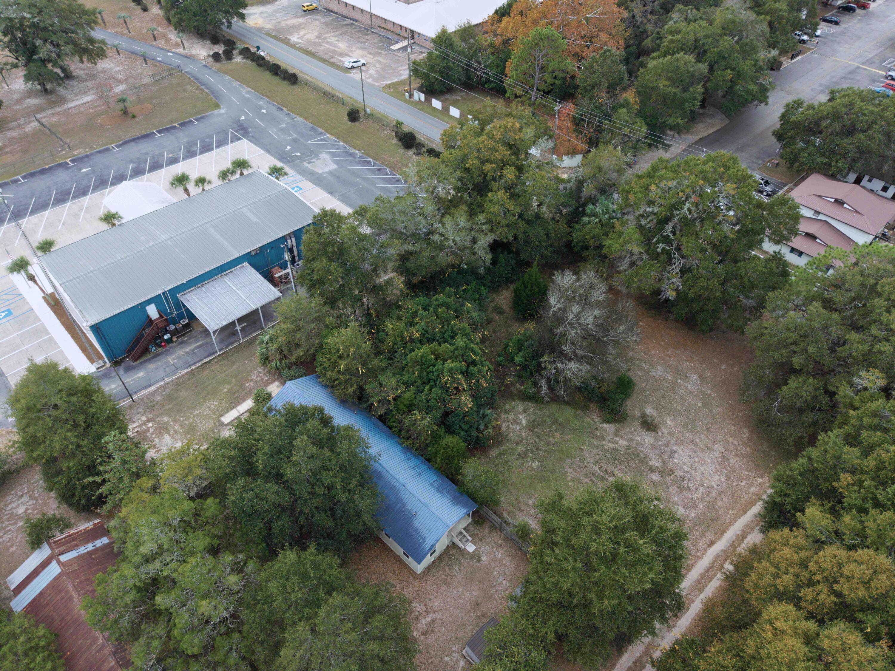 120 North Davis Lane DeFuniak Springs, FL 32433 - Photo 6 of 58 an aerial view of a house with a yard and greenery
