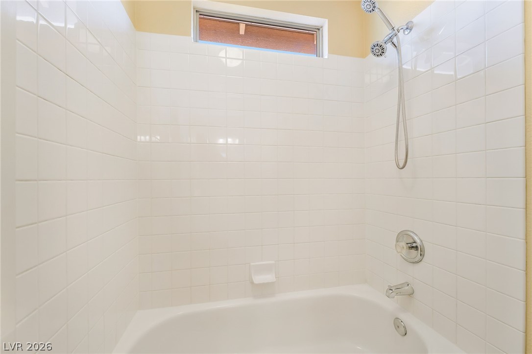 271 Pointe Ranier Avenue Henderson, NV 89012 - Photo 22 of 26 This clean and bright bathroom features a classic shower and tub combination, perfect for everyday living.