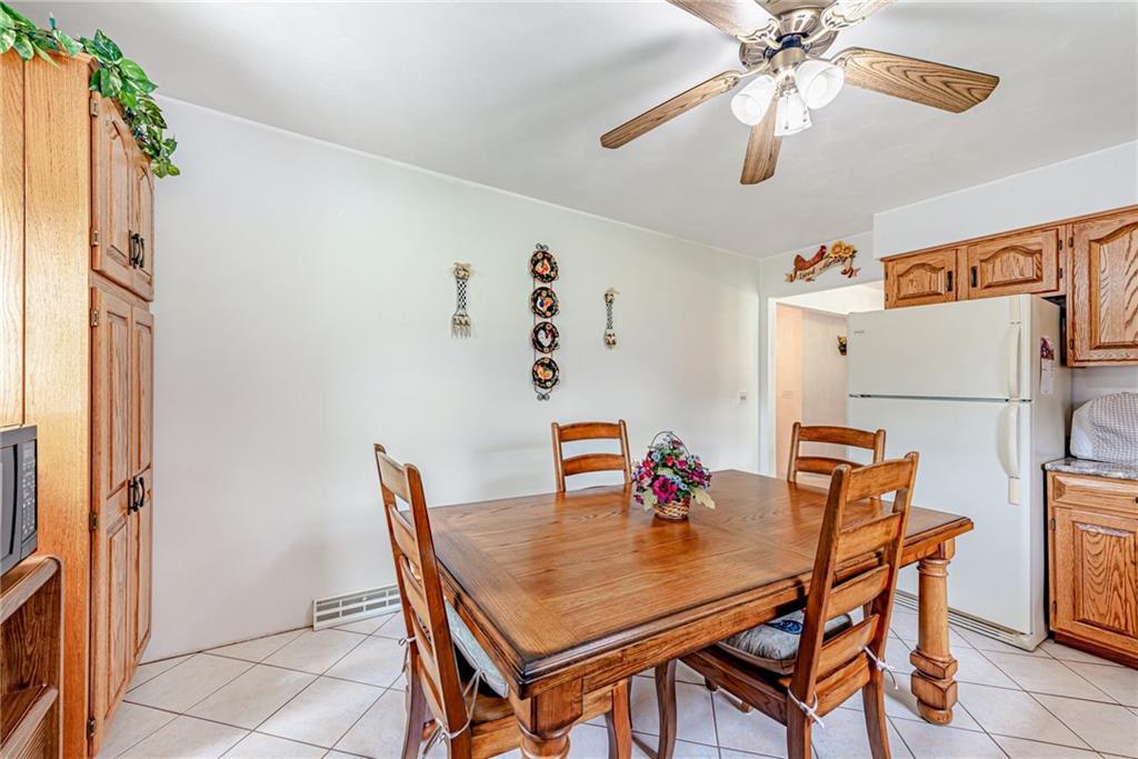 514 White Road Normalville, PA 15469 - Photo 12 of 32 a dining room with furniture and wooden floor