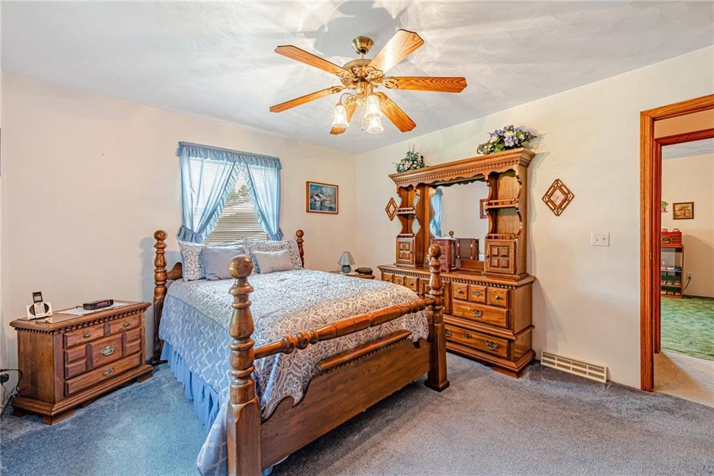 514 White Road Normalville, PA 15469 - Photo 16 of 32 a bedroom with bed and a chandelier
