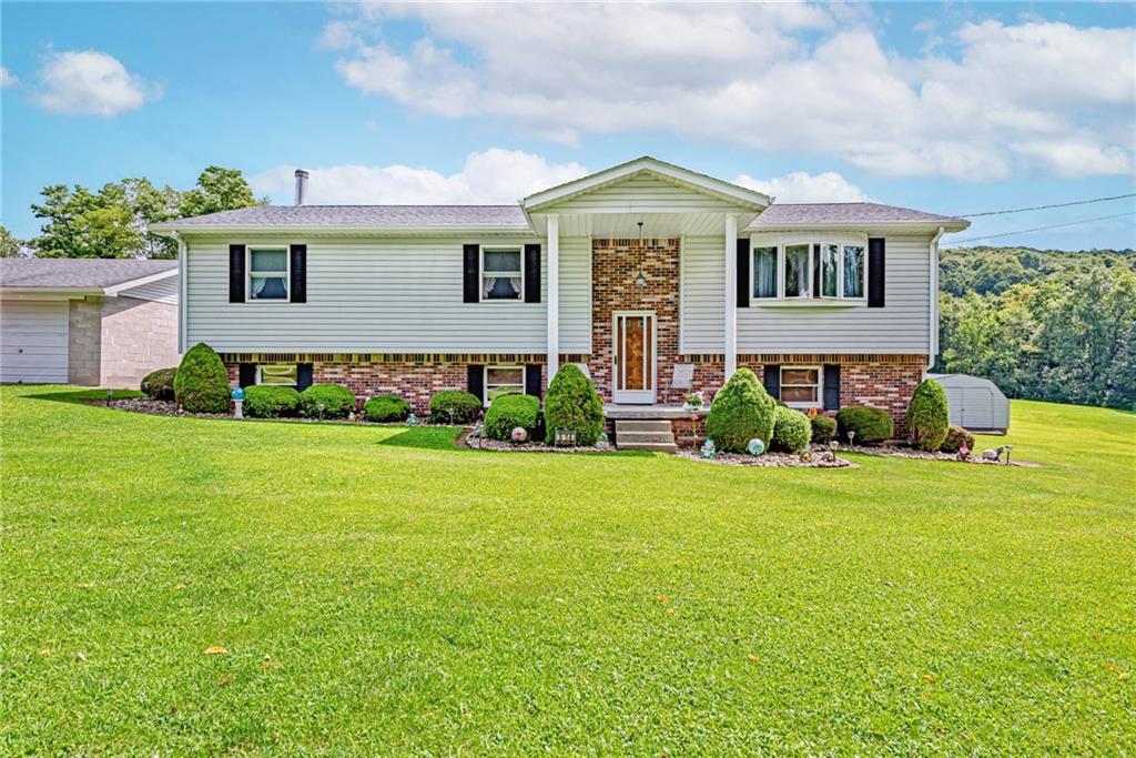 514 White Road Normalville, PA 15469 - Photo 27 of 32 a front view of a house with garden