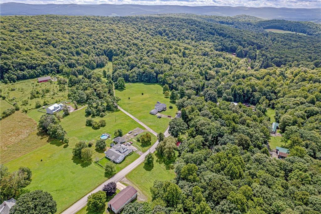514 White Road Normalville, PA 15469 - Photo 30 of 32 an aerial view of a house with a yard