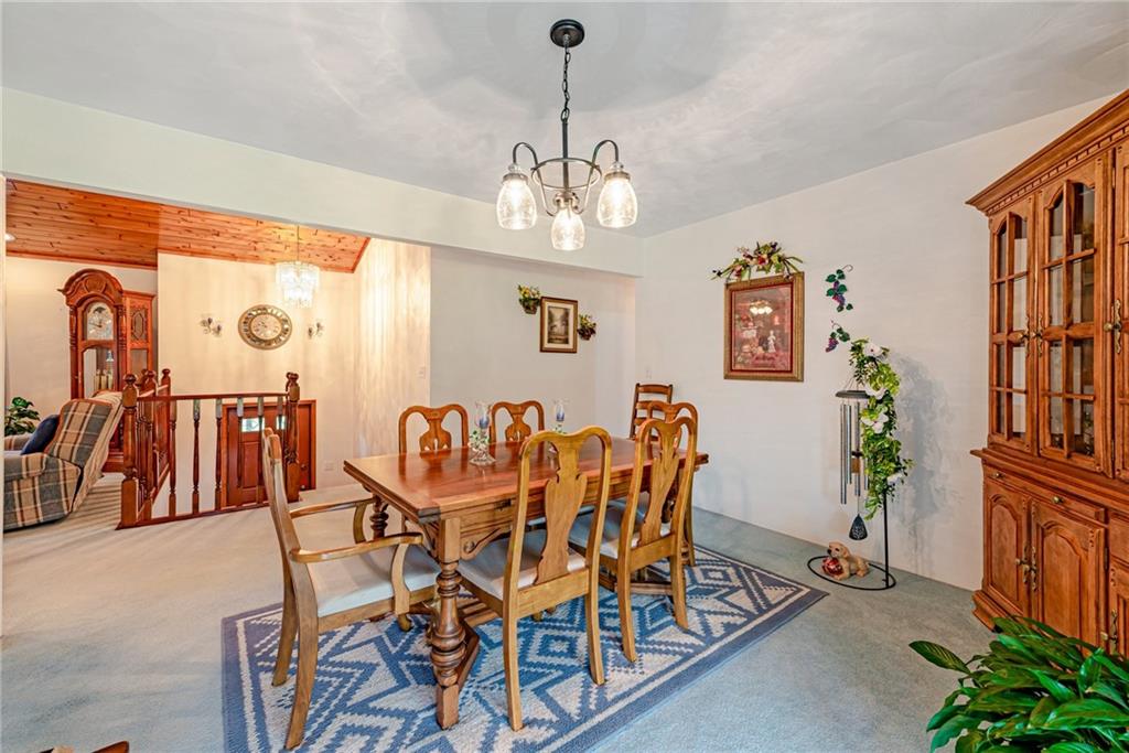 514 White Road Normalville, PA 15469 - Photo 7 of 32 a dining room with furniture entryway and wooden floor