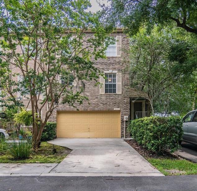 3571 Edington Way Palm Harbor, FL 34685 - Photo 1 of 1 a front view of a house with a yard and garage