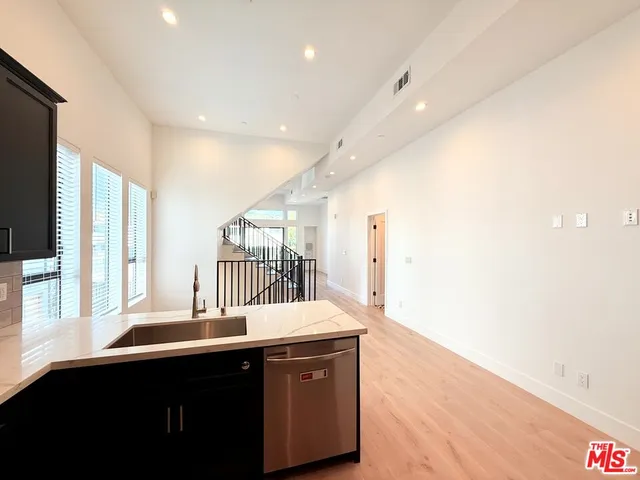 a kitchen with a sink and a window