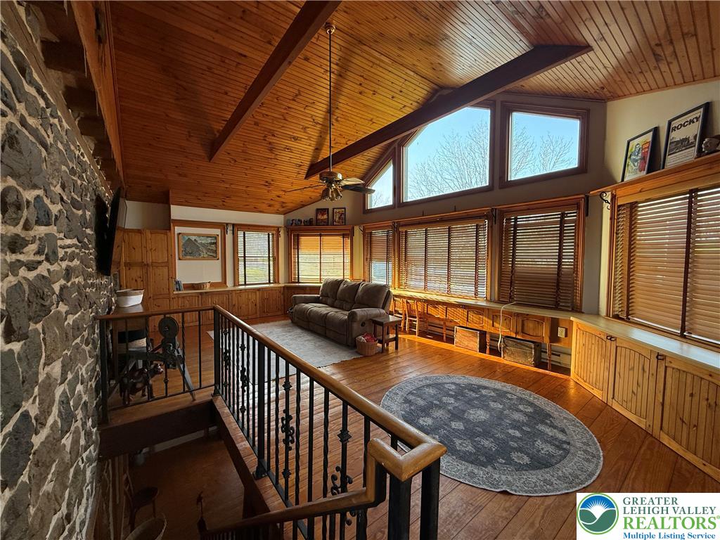 940 Jacktown Road Bangor, PA 18013 - Photo 14 of 33 A spacious common area with vaulted wood ceilings and exposed beams offers a warm and inviting atmosphere.