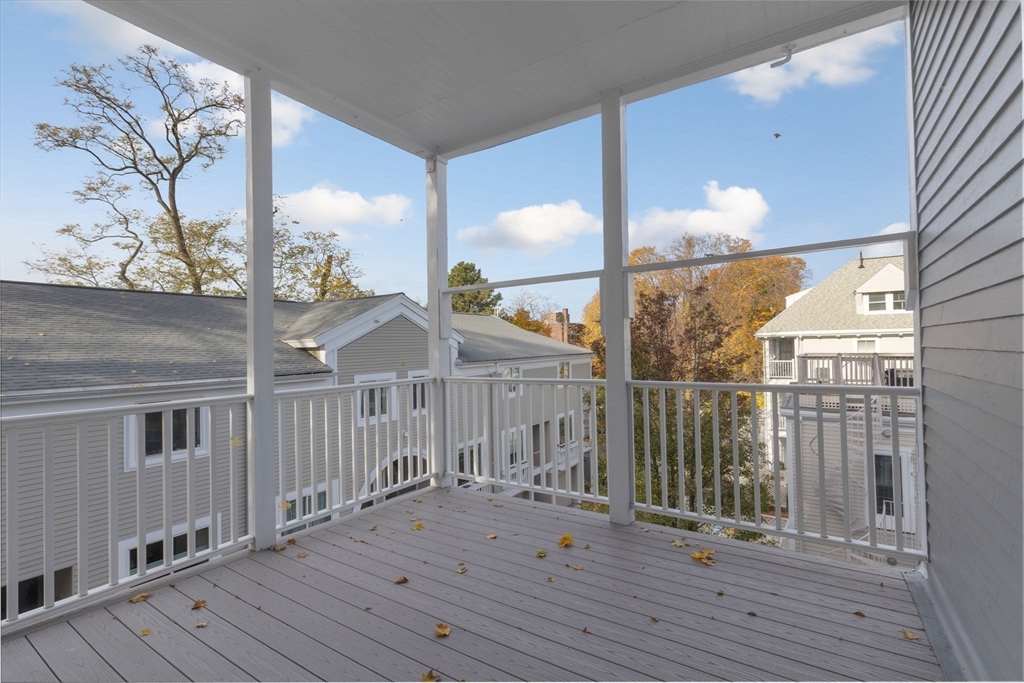 39 Ellery Street, Unit 6 Cambridge, MA 02138 - Photo 13 of 14 a view of a balcony with wooden floor