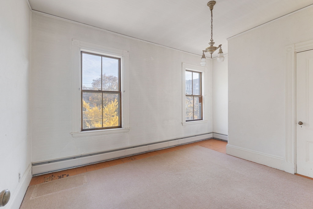 39 Ellery Street, Unit 6 Cambridge, MA 02138 - Photo 5 of 14 a view of an empty room with a window