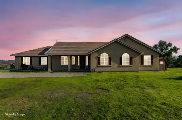 a front view of a house with yard