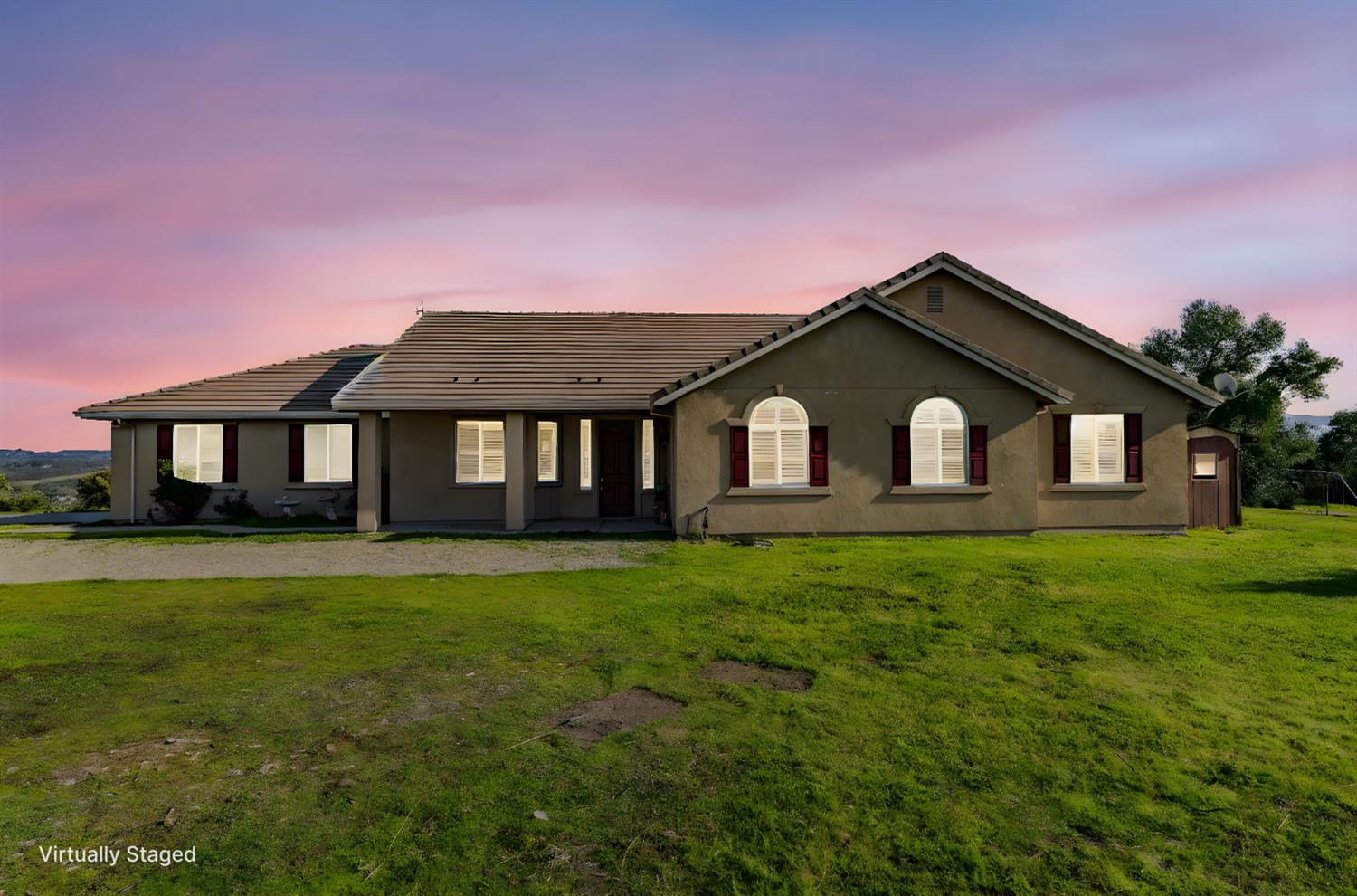 a front view of a house with yard