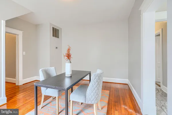 a kitchen with appliances a stove a microwave and cabinets