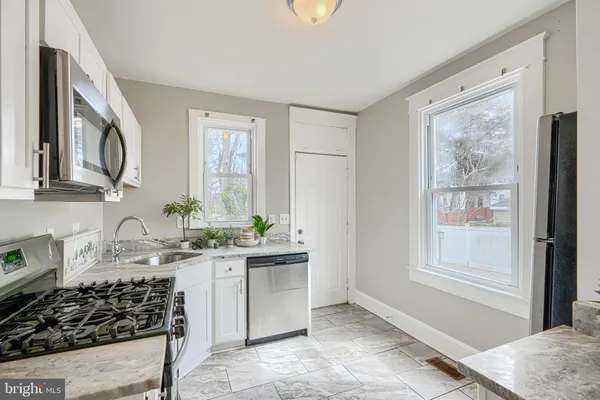 a view of a balcony with wooden floor and fence