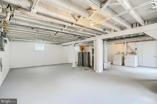 a view of a room with window and wooden floor