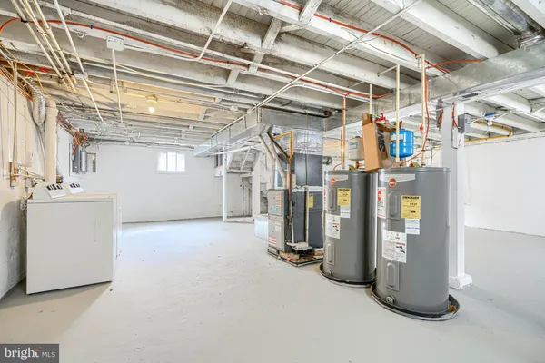 a kitchen with stainless steel appliances granite countertop a refrigerator stove and oven