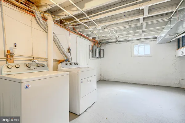 a kitchen with stainless steel appliances granite countertop a refrigerator stove top oven and sink