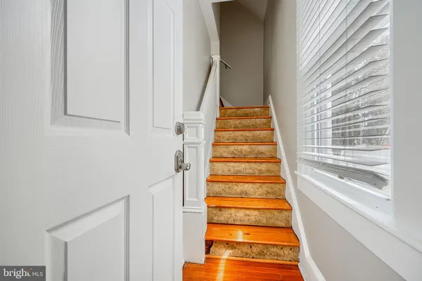 a kitchen with stainless steel appliances granite countertop a refrigerator microwave and sink