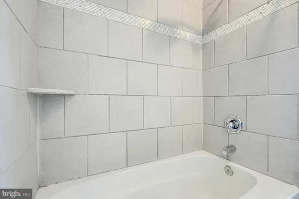 a picture of a bench in front of a building