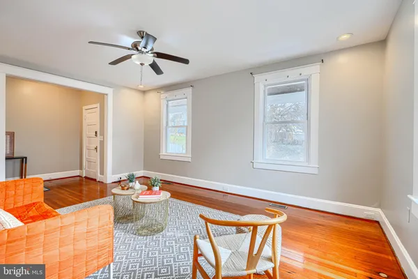 a view of a room that has a table and chairs in it